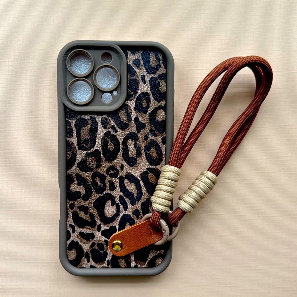 Fun leopard iPhone 16 pro max case with leather wrist strap
